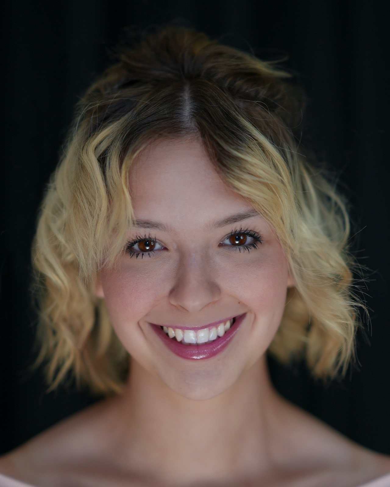 Actor headshot with soft lighting on a dark backdrop in Las Vegas