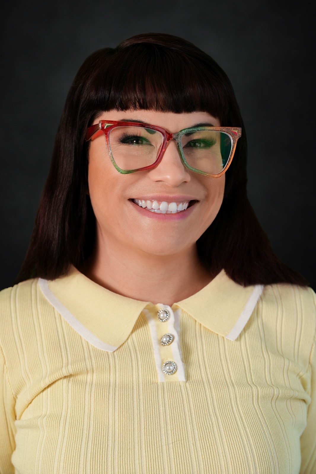 Character actor headshot with bold glasses on a grey backdrop, Las Vegas